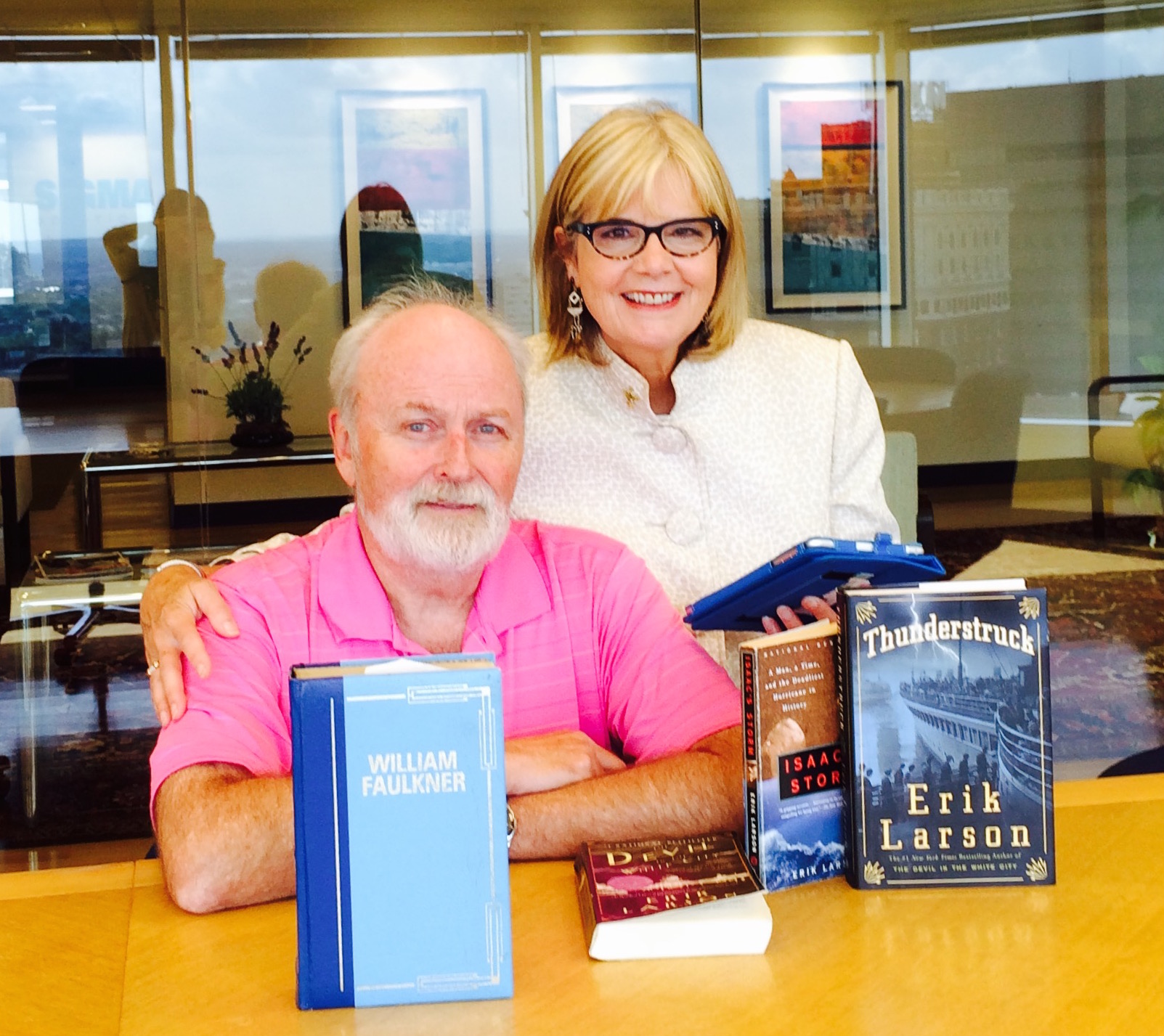 Read Frontier book reviewers Pat Malloy and Karen Keith pose with some of their favorite books. /Courtesy