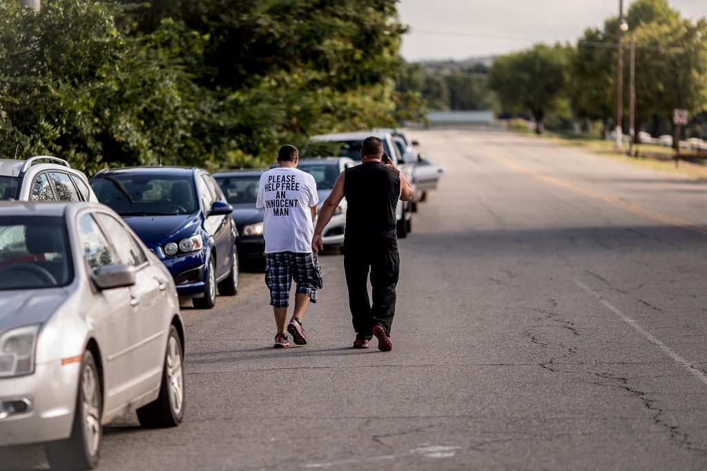 9/30/15 4:34:33 PM -- Supporters of Richard Glossip leave the protest area outside the Oklahoma State Penitentiary in McAlester, Oklahoma on the day of Richard Glossip's execution.  Photo by Shane Bevel/The Frontier