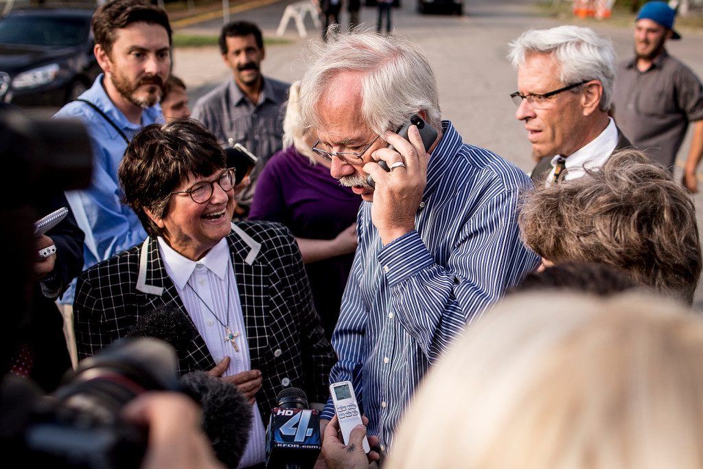 9/30/15 4:49:44 PM -- Sister Helen Prejean speaks to the media as Kim Van Atta speaks to Richard Glossip via phone about the stay of execution issued by Gov. Mary Fallin because the state lacked the correct drug. Photo by Shane Bevel/The Frontier