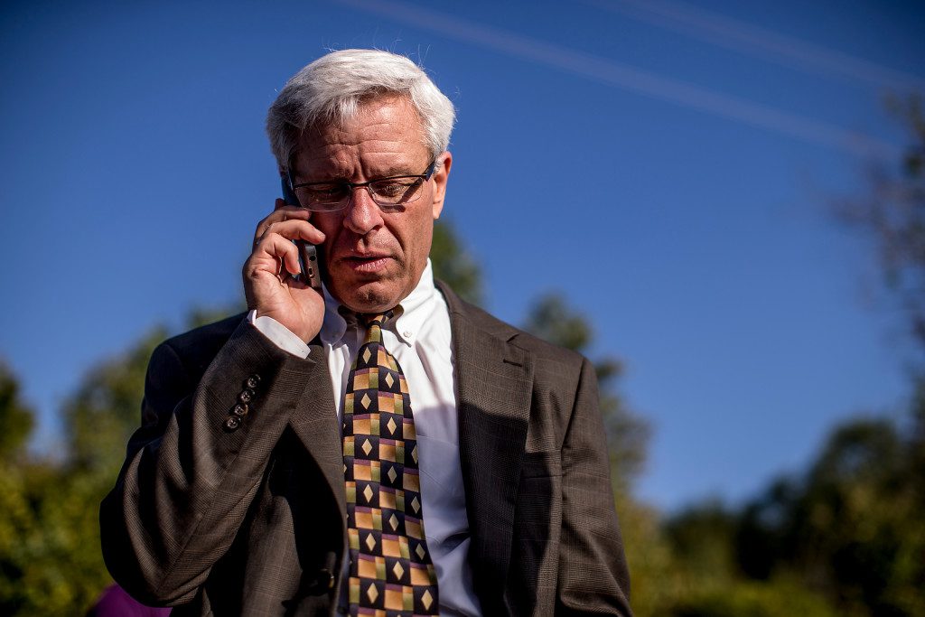 9/30/15 5:00:56 PM -- Don Knight, attorney for Richard Glossip, speaks to him by phone after his execution was stayed by Mary Fallin outside the Oklahoma State Penitentiary in McAleste Photo by Shane Bevel/The Frontier