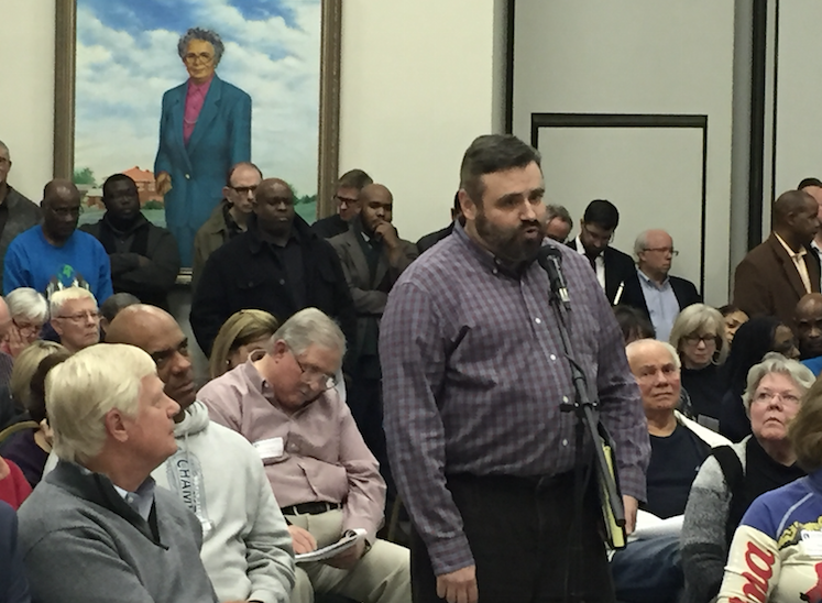 Tulsan Brent Isaacs speaks at Monday night's town hall meeting on the city's proposed Vision 2025 sales tax extension. The meeting was held at the 
